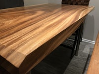 a dining table with a wooden top