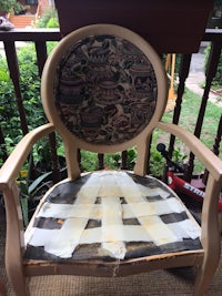 a chair covered in tape on a porch