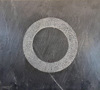 a drawing of a circle on a black surface